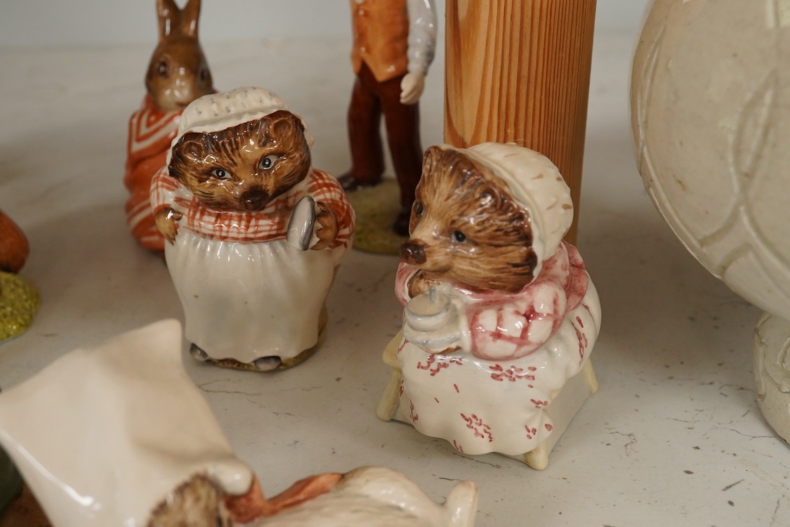 A collection of Beswick and Royal Albert Beatrix Potter figures to include Little Black Rabbit and The Head Gardener, together with two plates, 19cm wide